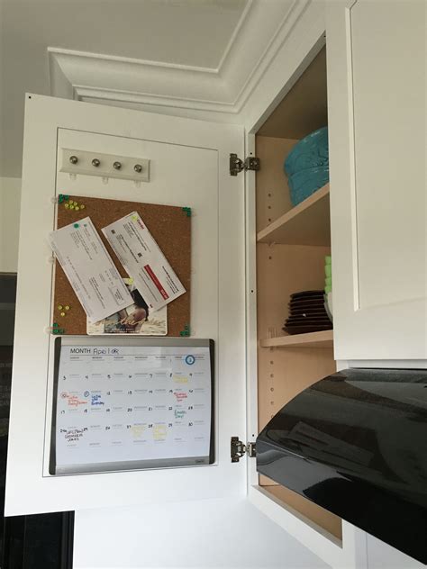 Little fridge inside cabinet below tv. Keep the clutter off your fridge....use the inside of a ...