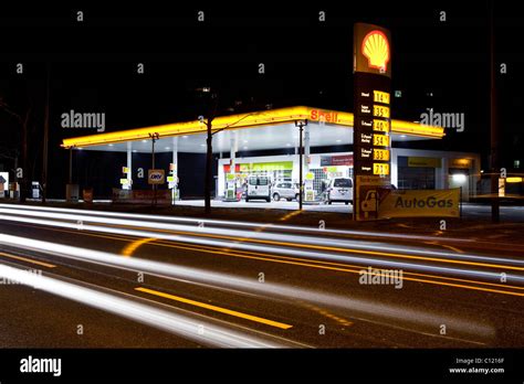 Shell Gas Station At Night With Car Traffic Stock Photo Alamy
