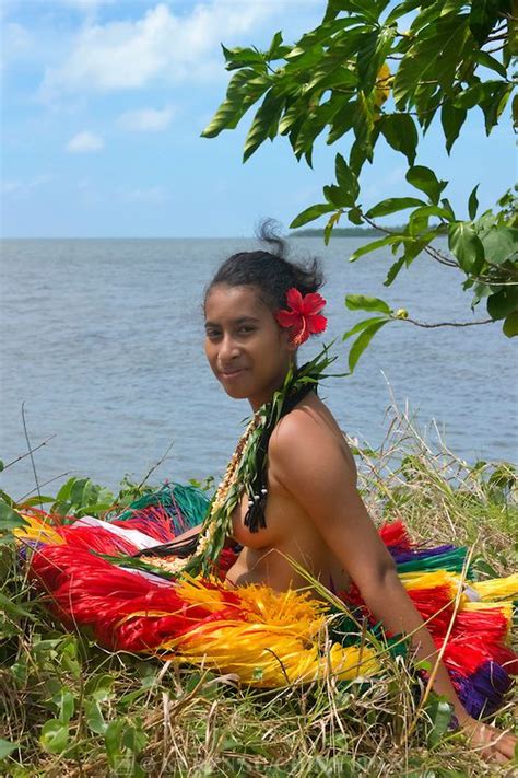 Yapese Girl In Grass Skirt Sitting By The Ocean Yap Island Federated