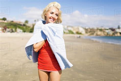 Portrait Of Blond Woman On Beach Stock Photo Dissolve