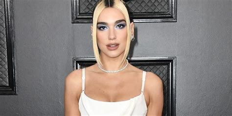 In A Shiny Jumpsuit Dua Lipa Shows Off Her Rear While Moving Her Body