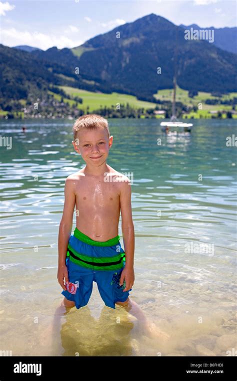 A Boy Six Years Old Swimming In The Walchsee Lake Tirol Austria