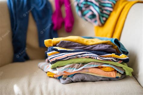 Premium Photo What To Wear Messy Colorful Clothing On A Sofa