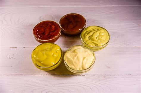 Different Sauces In Glass Bowls On Wooden Table Stock Image Image Of