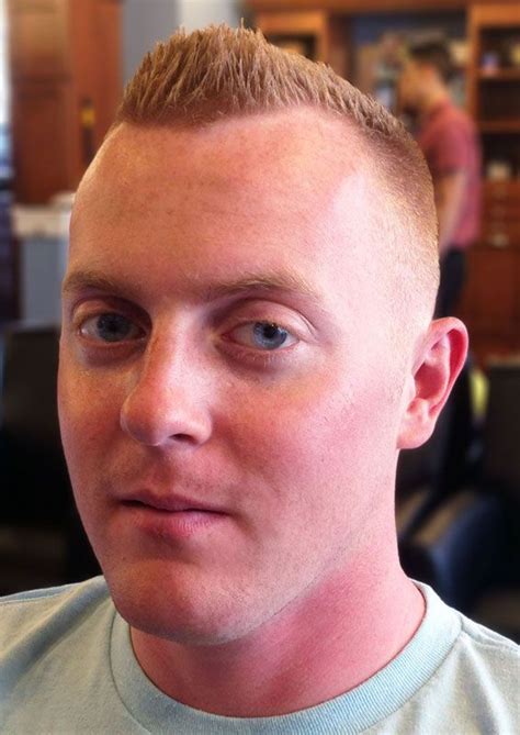 This is a medium bald fade haircut with the stop styled as ...