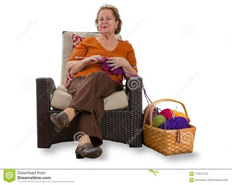 Happy Elderly Lady Relaxing In A Wicker Chair Stock Image Image Of