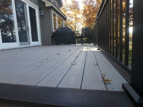 Why did we choose azek for our deck? Here is a Slate Gray Azek deck with a Dark Hickory border ...