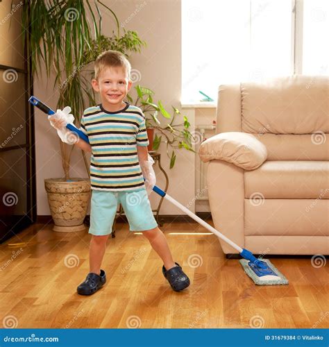 Little Boy Cleaning The Apartment Washing The Floor Stock Photo