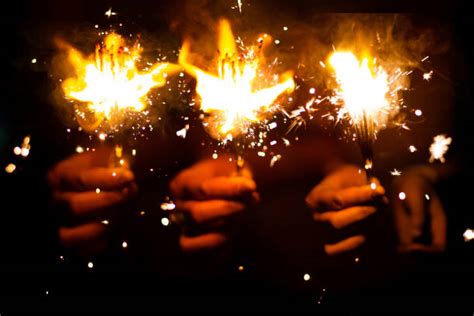 Hand Holding Sparklers Stock Photos Pictures And Royalty Free Images