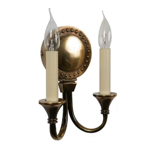 Exquisite workmanship keeps the product shiny and. Double Wall Sconce in Solid Brass with Light Antique Finish