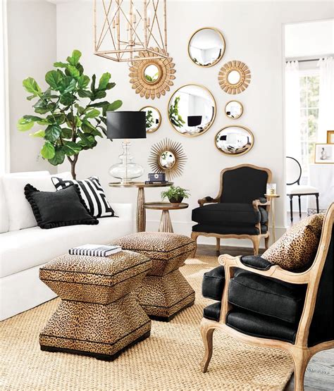 A Living Room Filled With Lots Of Furniture And Mirrors On The Wall