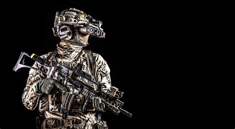 Soldier In Night Vision Device On Black Background Stock Photo