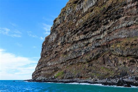 Massive Sea Cliff Towering Over The Water Stock Photo Image Of Water