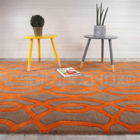 Maybe you would like to learn more about one of these? Tapis design orange et taupe en laine par Joseph Lebon