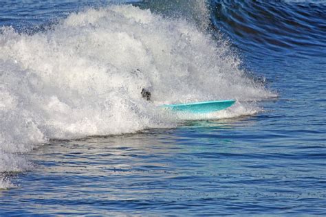 Surfer With Blue Surf Board 1029 09 102 Stock Photo Image Of Spray
