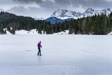 Woman Walking On Frozen Lake Photograph By Timm Humpfer Pixels