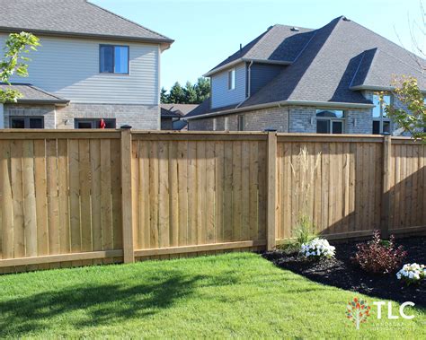 Pressure Treated Solid Board Fence With 6x6 Posts Black Metal Caps
