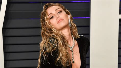Miley Cyrus Looks Ready To Party As Woodstock Headliner In Nude