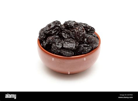 Dried Prunes In Bowl On White Background Closeup Stock Photo Alamy