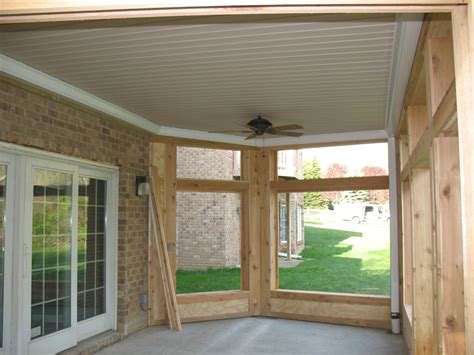 They had to install the metal framework for the panels to sit in so that had to go in first and was a bit time consuming because of our angled wall down there. Under Deck Ceiling Systems | NeilTortorella.com