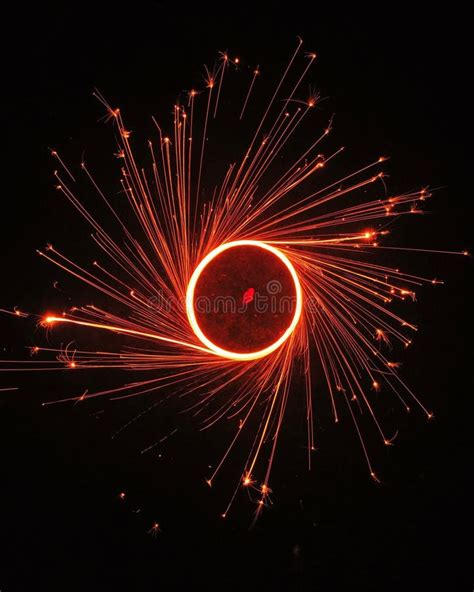 Vertical Shot Of A Spinning Round Fire Circle In Long Exposure Stock