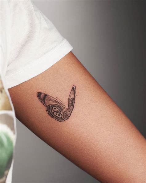 Fine Line Butterfly Tattoo On The Inner Arm