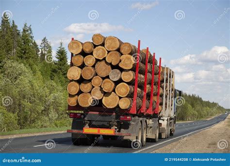 Loaded Timber Truck Rides On The Highway Road Transport Stock Photo