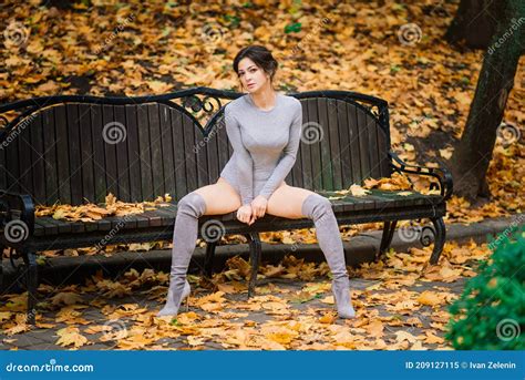 Brunette Female In Autumn Forest Public Park Sport Slender Body Stock