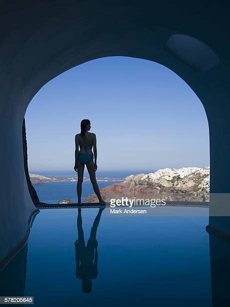 Woman Backlit Infinity Pool Photos And Premium High Res Pictures