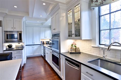 But the style of the end product also depends on materials and colors. Kitchen with white cabinets and coffered ceiling ...