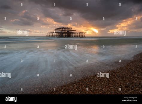 Sunset At West Pier Ruins In Brighton East Sussex England Stock Photo
