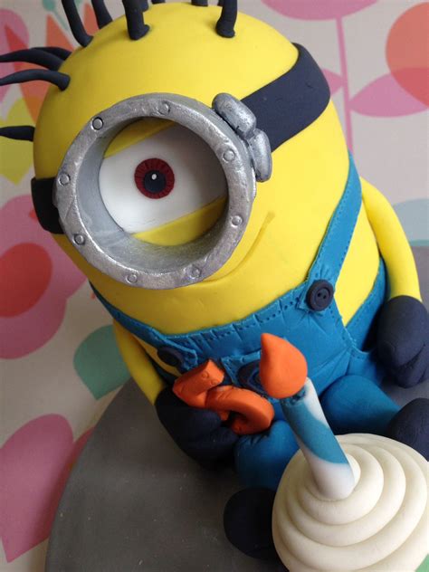 I decided after i had the minion's body decorated that he needed a hat and legs and arms. Minion cake Www.theowlbakery.com | Minion cake, Celebration cakes, Minions