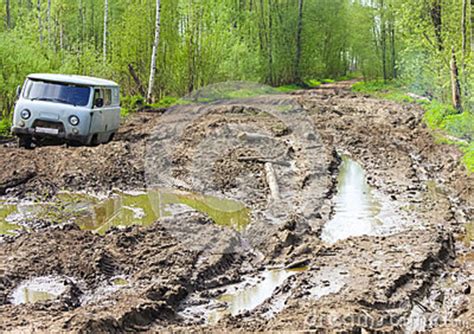 What to do if your car is stuck in mud? Car Stuck In The Muddy Forest Road Stock Photo - Image of ...