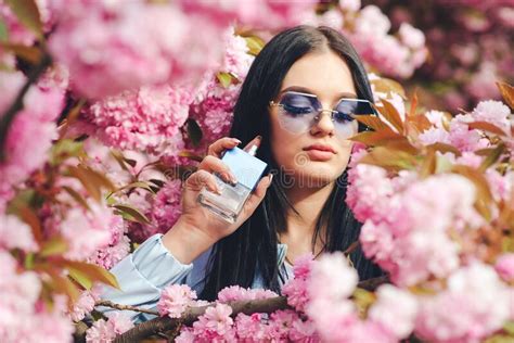 Spring Day Beautiful Sensual Woman Applying Perfume Woman With Pink