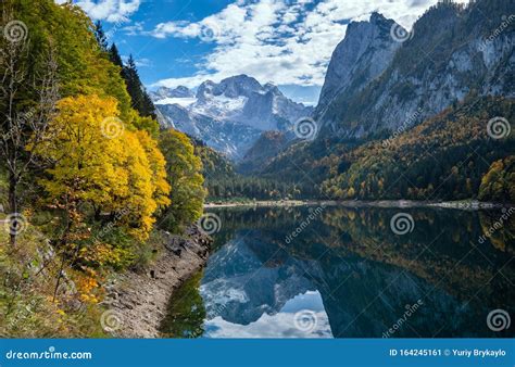 Peaceful Autumn Alps Mountain Lake With Clear Transparent Water And
