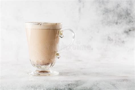 Traditional Winter Eggnog In Glass Mug With Milk Rum And Cinnamon And Chocolate Covered With