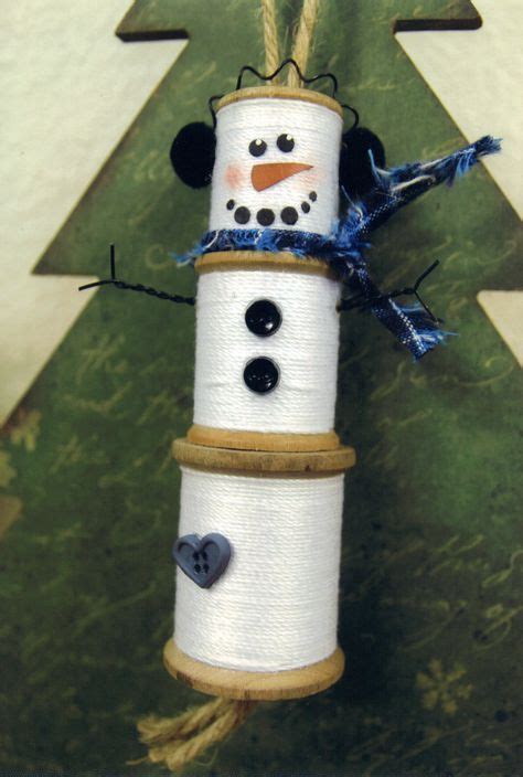 Snowman Made With Three Wooden Spools Wrapped With Crochet Thread