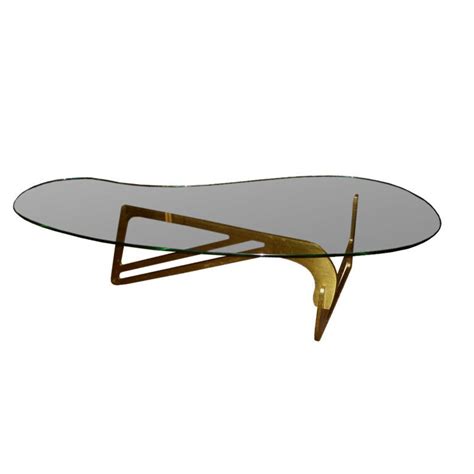 A glass top coffee table enhances the living space due to the transparent nature of the glass. Mid century modern Bronze and bimorphic glass top coffee ...