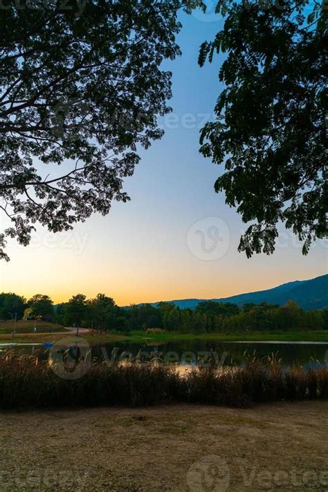 Download Beautiful Lake At Chiang Mai With Forested Mountain And
