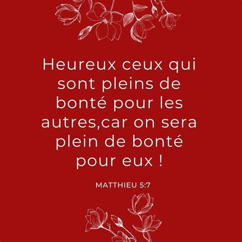 A Red Background With White Flowers And The Words Heureux Ex Quii Son