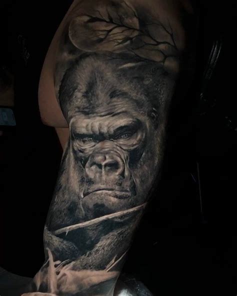 A Man With A Gorilla Tattoo On His Arm