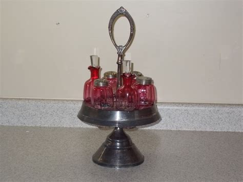 vintage silver plate meridian castor set with six rubina glass bottles antique price guide