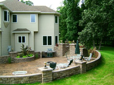 Stained Concrete Patio With Retaining Walls And Lots Of Landscape