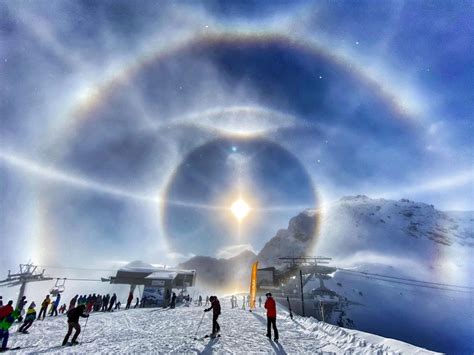 Tiny Ice Crystals Simulate A Halo Around The Sun In Photograph By