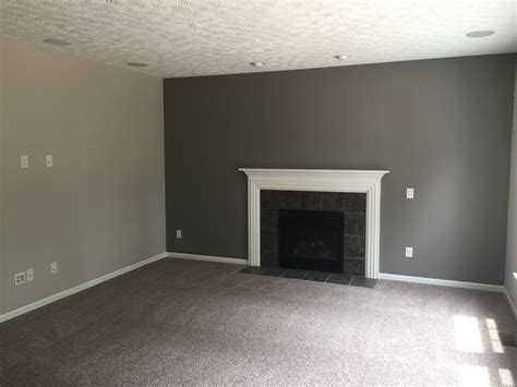 Agreeable gray walls with dark cabinets. Our carpet is Mohawk brand in Rainswept gray. The dark ...