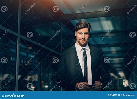 Handsome Young Businessman Looking At Camera And Smiling Stock Image