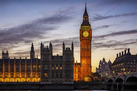 The Illuminated Westminster Palace And Big Ben Clock Tower In London