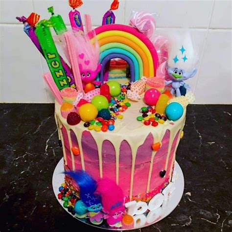 A Birthday Cake Decorated With Candy And Decorations