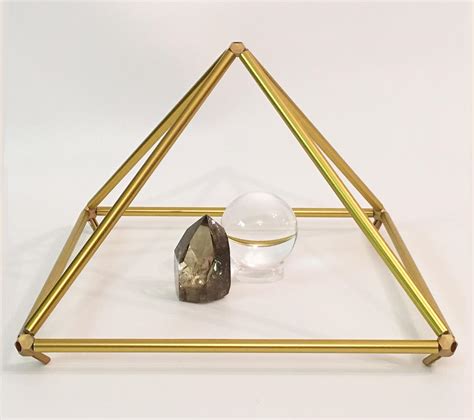The oval faceted tourmaline measure 6mm x 4mm with a weight of. Gold Anodized Pyramid