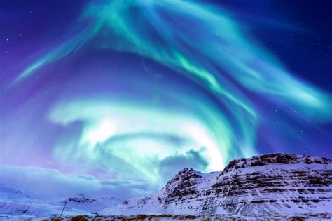 Its coastlines are fringed with ragged fjords, its interior is speckled with lava fields and active. Northern Light at Kirkjufell, Iceland jigsaw puzzle in ...